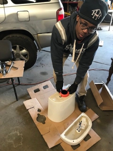 H & H Youth training program guiding young men in bathroom restoration including: toilet assembly and machinery operation. IMG 1964 640x480